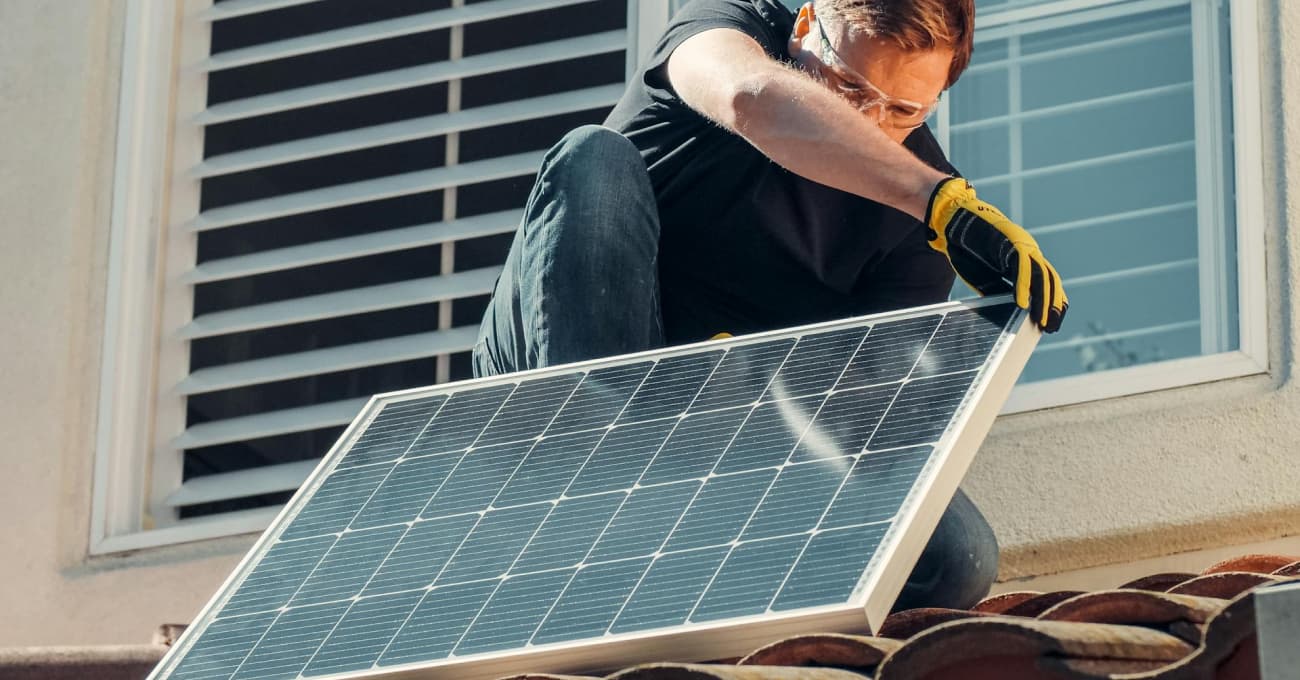 man-installing-solar-panles